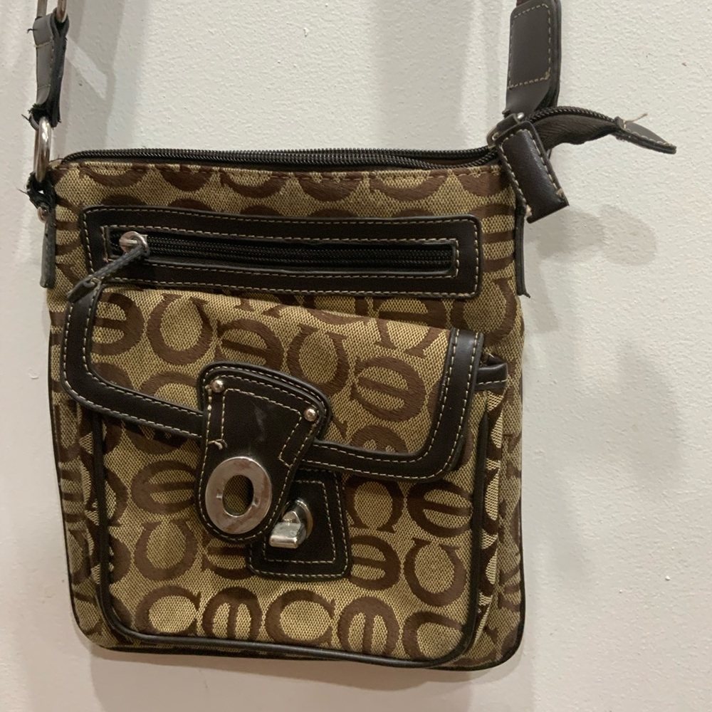 Brown and tan crossbody handbag.